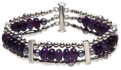 Multi-strand bracelet with spacer bars
